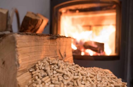 Wood stove heating with in foreground wood pellets – economical heating system concept
